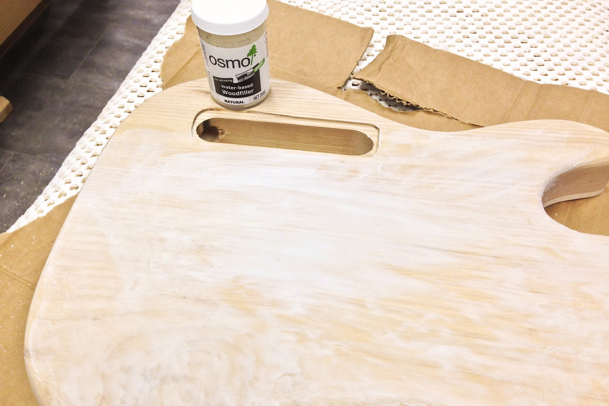 Grain is filled with Osmo wood filler to create a smooth surface for a flat lacquer finish