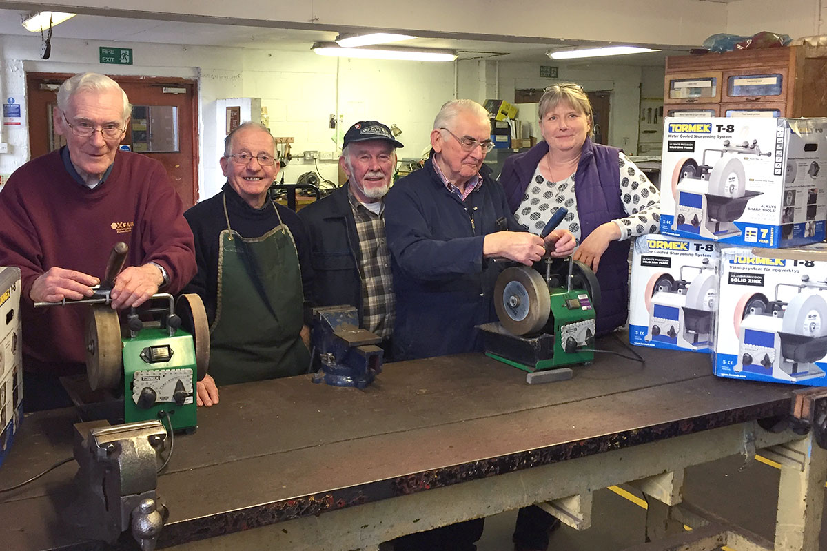 Tormek machines and volunteers at the Tools for Self Reliance HQ